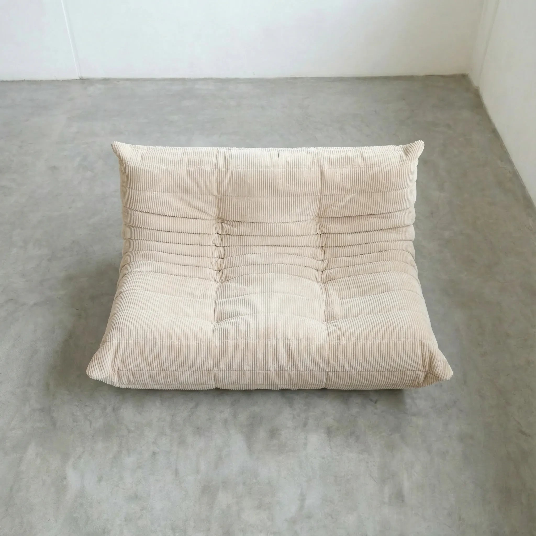 Togo 2-seater Sofa dupe in cream corduroy with Togo silhouette designed by michael ducaroy for ligne roset – custom-made by vibehaus