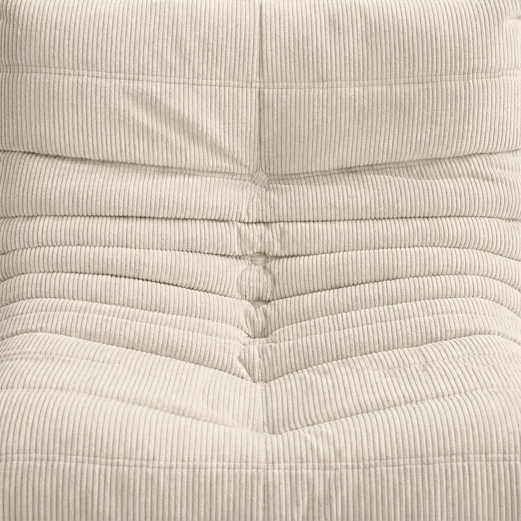 Close up of the Togo 2-seater Sofa dupe in cream corduroy with Togo silhouette designed by michael ducaroy for ligne roset – custom-made by vibehaus