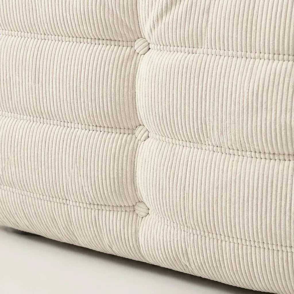 Close up of the Togo 2-seater Sofa dupe in cream corduroy with Togo silhouette designed by michael ducaroy for ligne roset – custom-made by vibehaus
