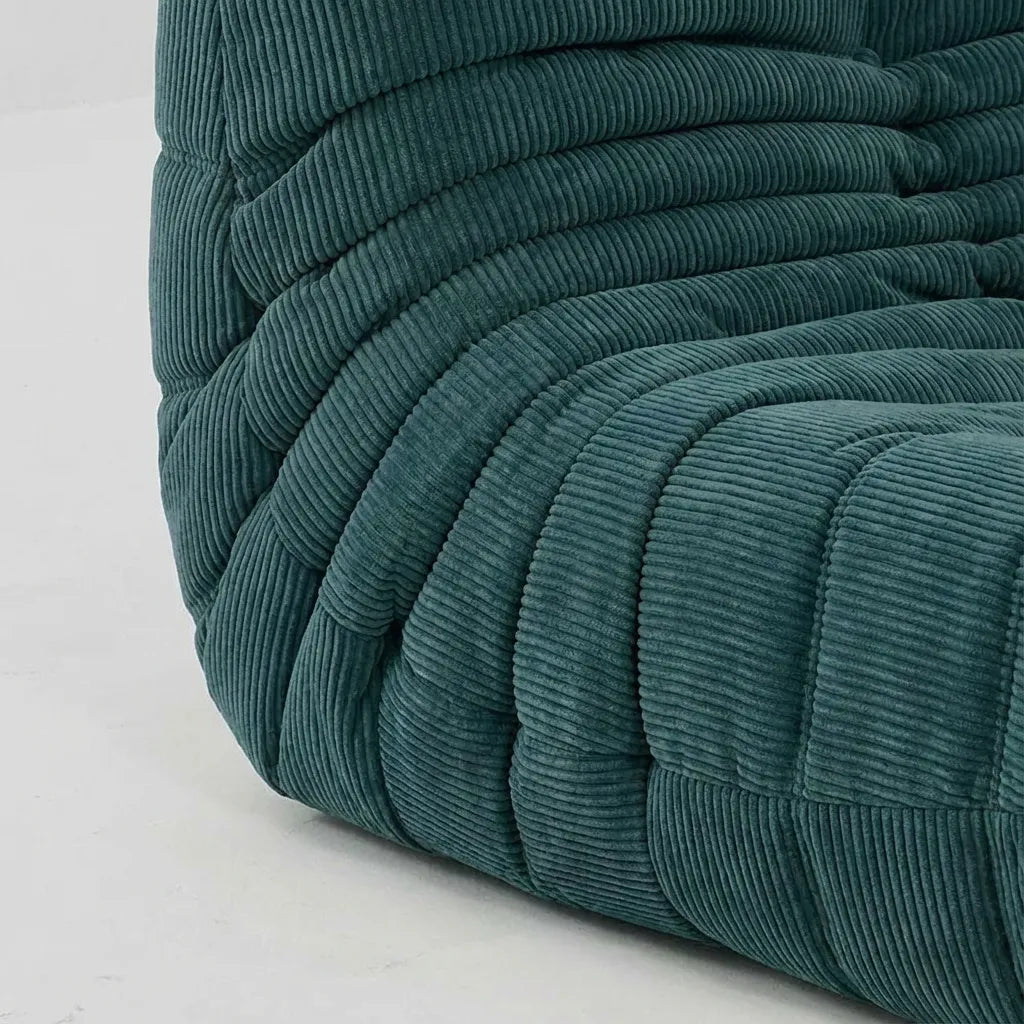 Close up of the Togo 2-seater Sofa dupe in turquoise blue corduroy with Togo silhouette designed by michael ducaroy for ligne roset – custom-made by vibehaus