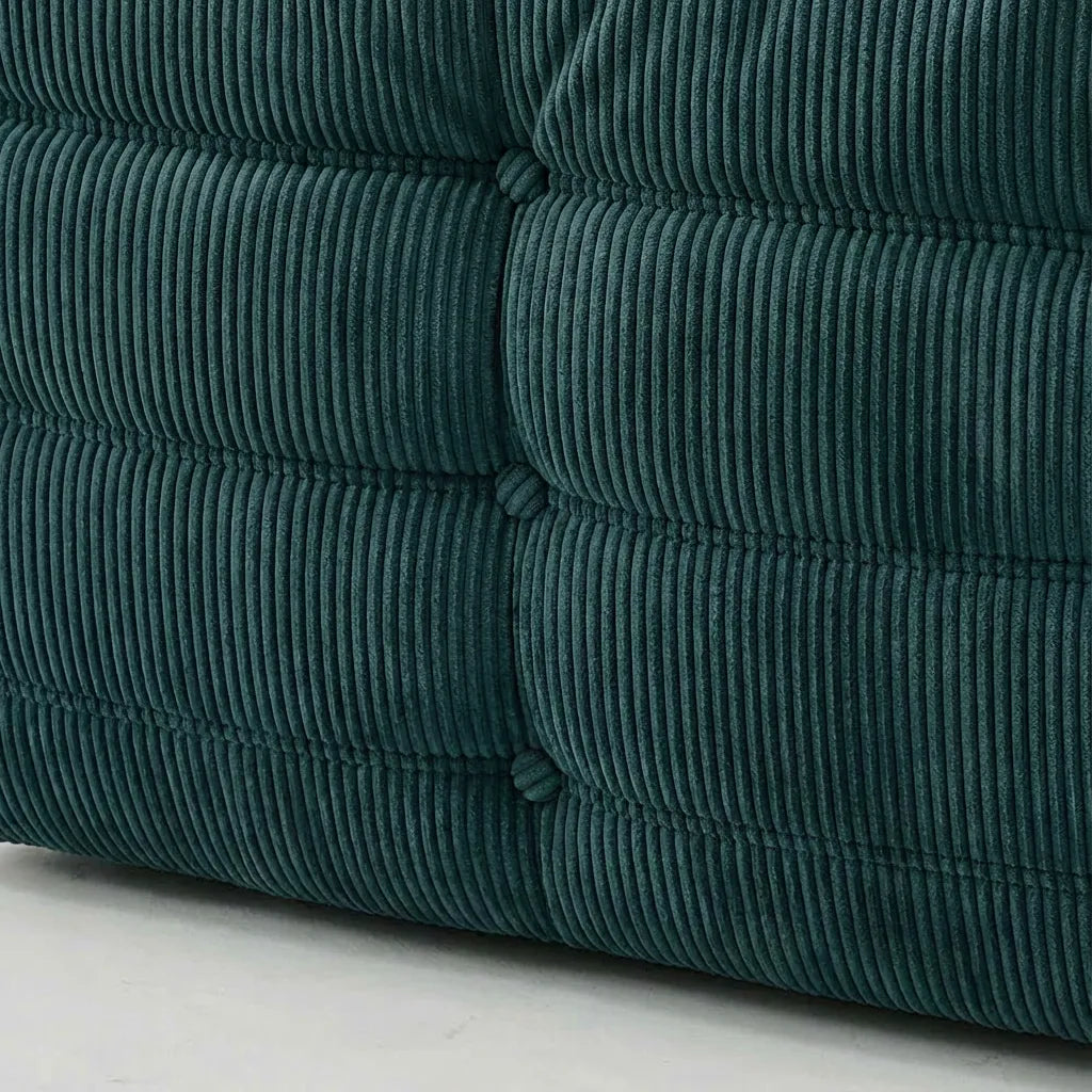 Close up of the fabric of the Togo 2-seater Sofa dupe in turquoise blue corduroy with Togo silhouette designed by michael ducaroy for ligne roset – custom-made by vibehaus