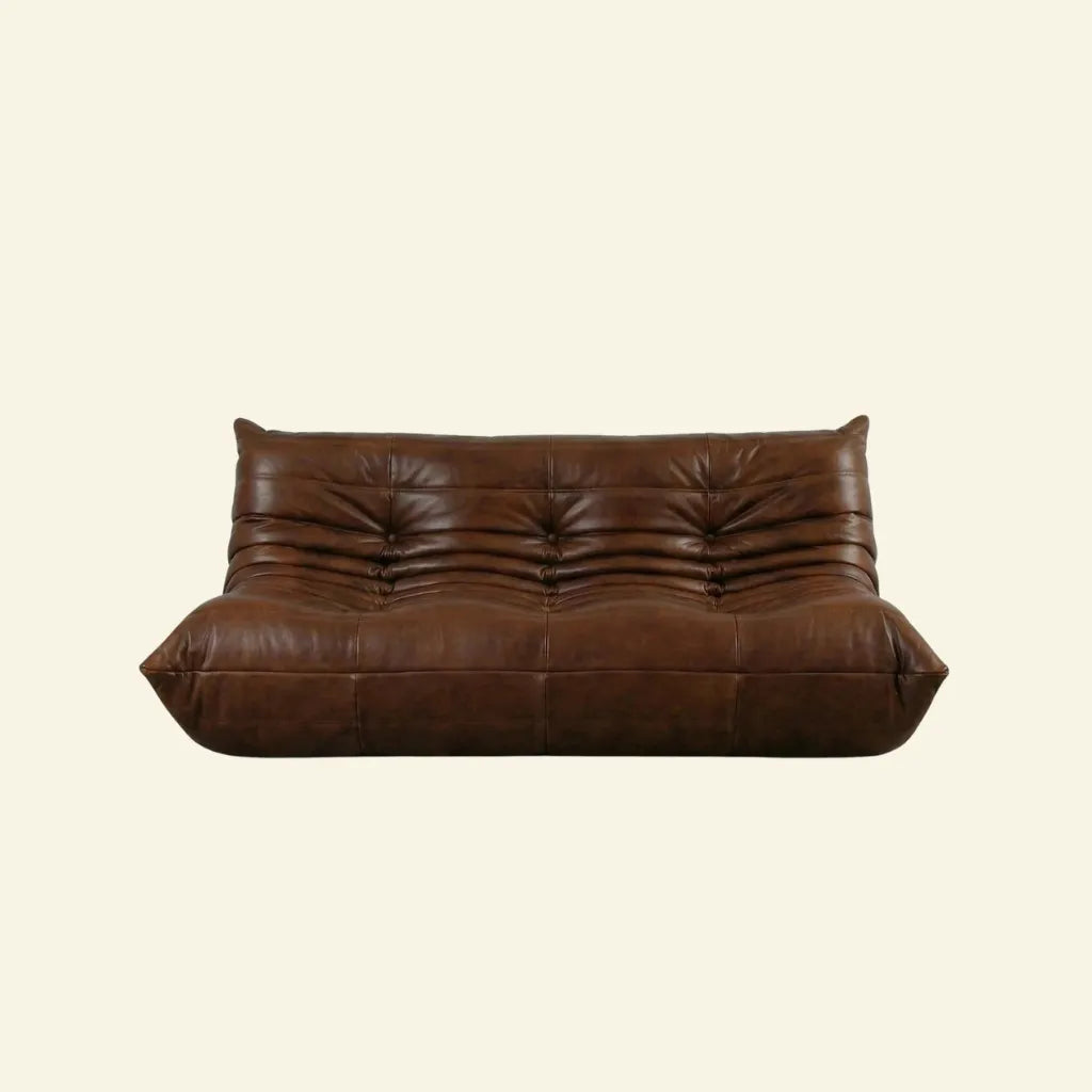 Brown leather togo sofa 3-seater dupe on a beige background