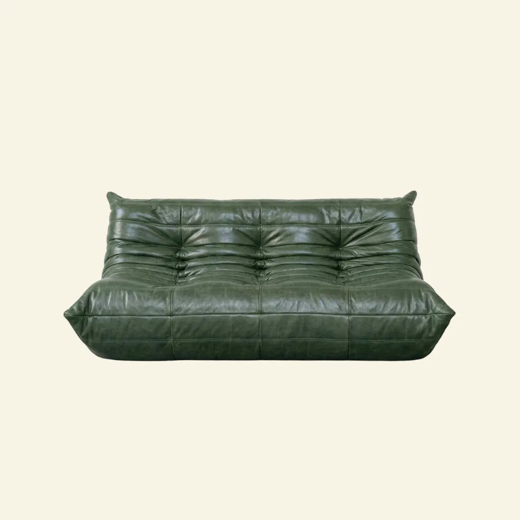 Green leather togo sofa dupe on a beige background