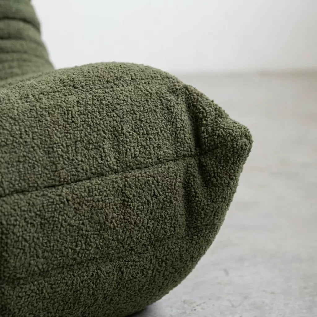 Close-up of the dupe green boucle togo fireside chair lounger – soft, dirt-resistant fabric with comfortable texture