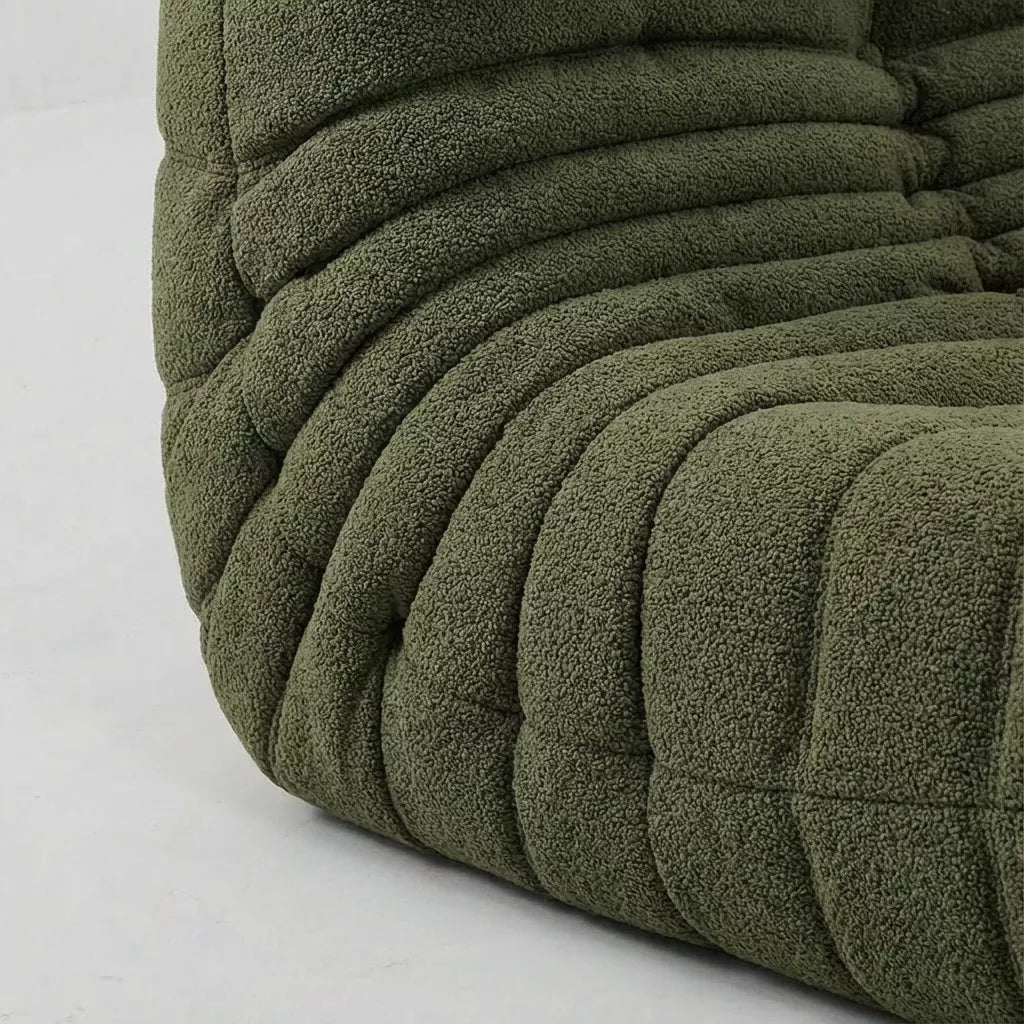 Close-up of the dupe green boucle togo fireside chair lounger – soft, dirt-resistant fabric with comfortable texture