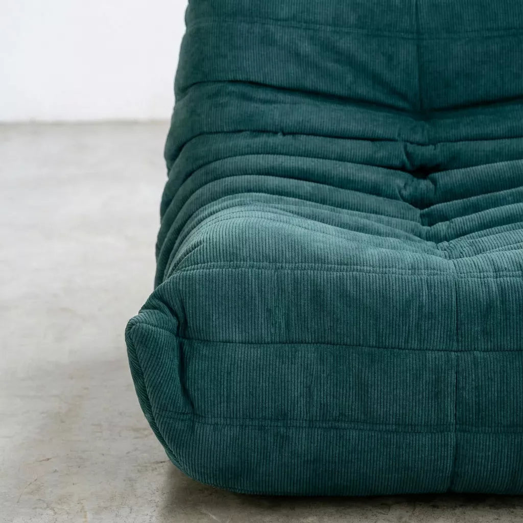 Relaxed modular chair dupe with Togo silhouette designed by michael ducaroy for ligne roset – custom-made turquoise corduroy seating for modern interiors