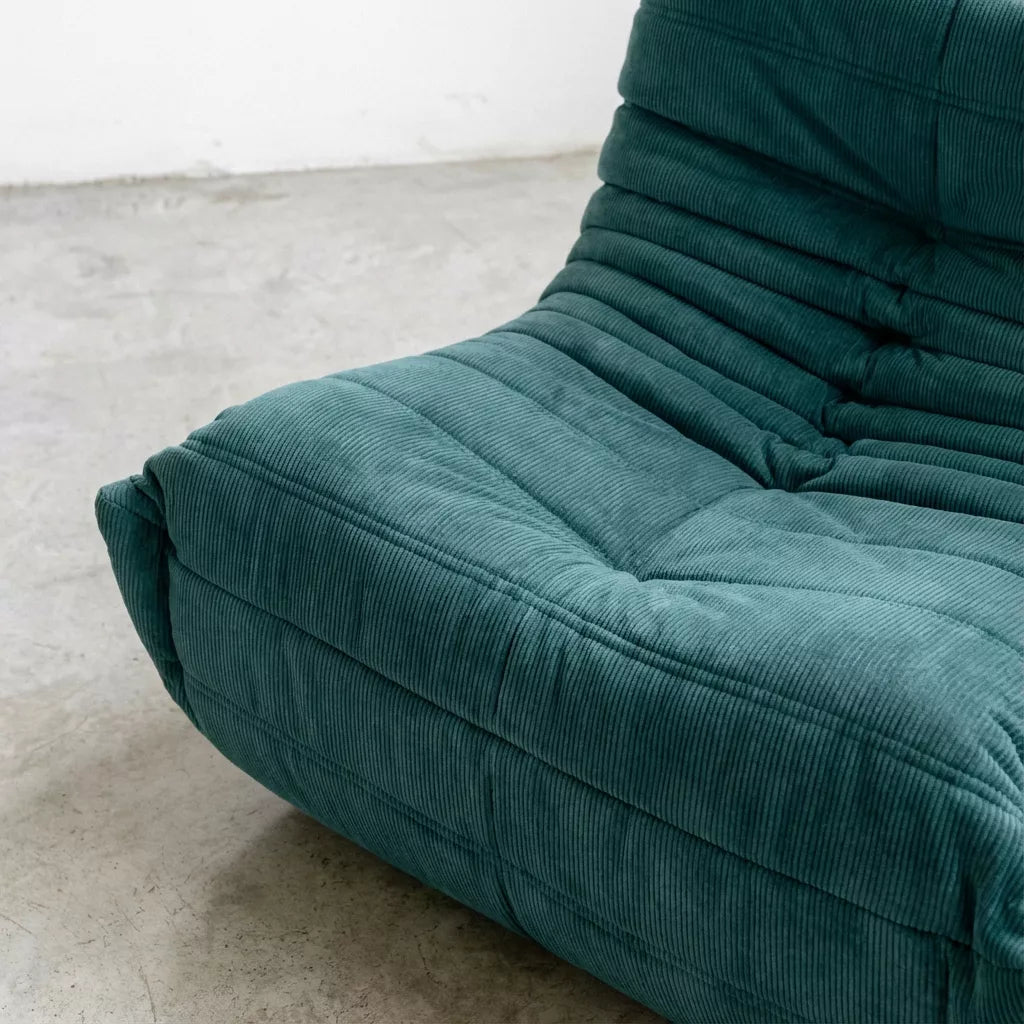 Relaxed modular chair dupe with Togo silhouette designed by michael ducaroy for ligne roset – custom-made turquoise corduroy seating for modern interiors
