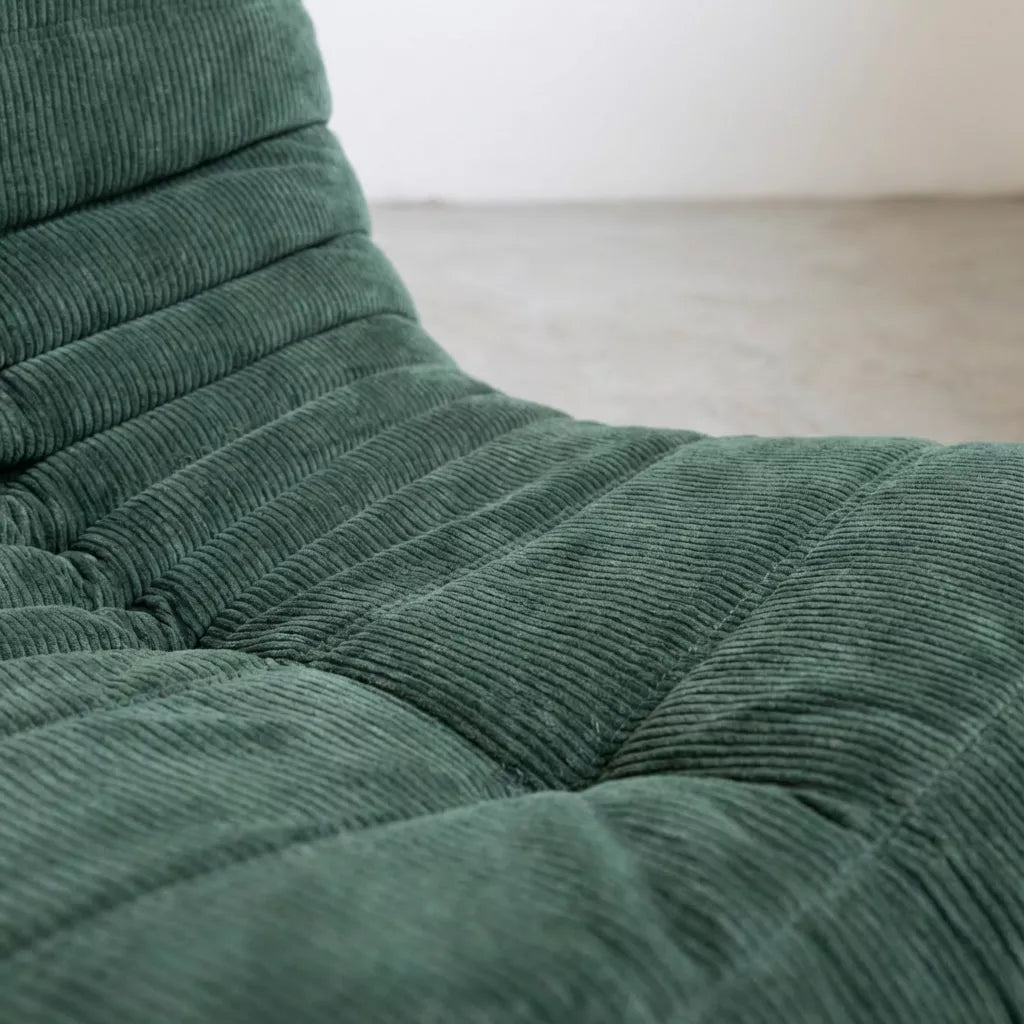 Handmade caterpillar sofa chair as dupe in corduroy green – plush high-density sponge filling for ergonomic comfort