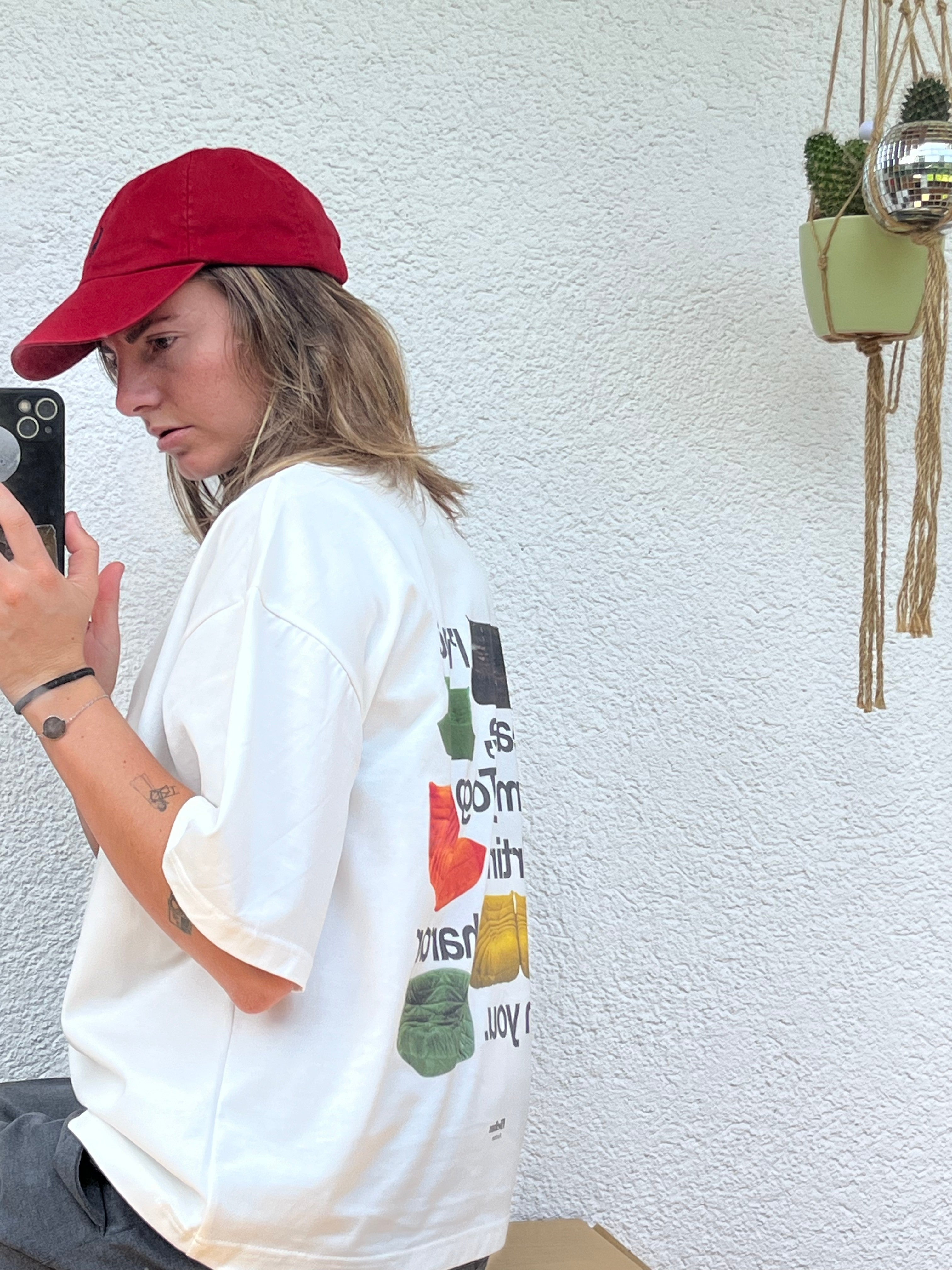 Model wearing the white togo sofa tee from vibehaus