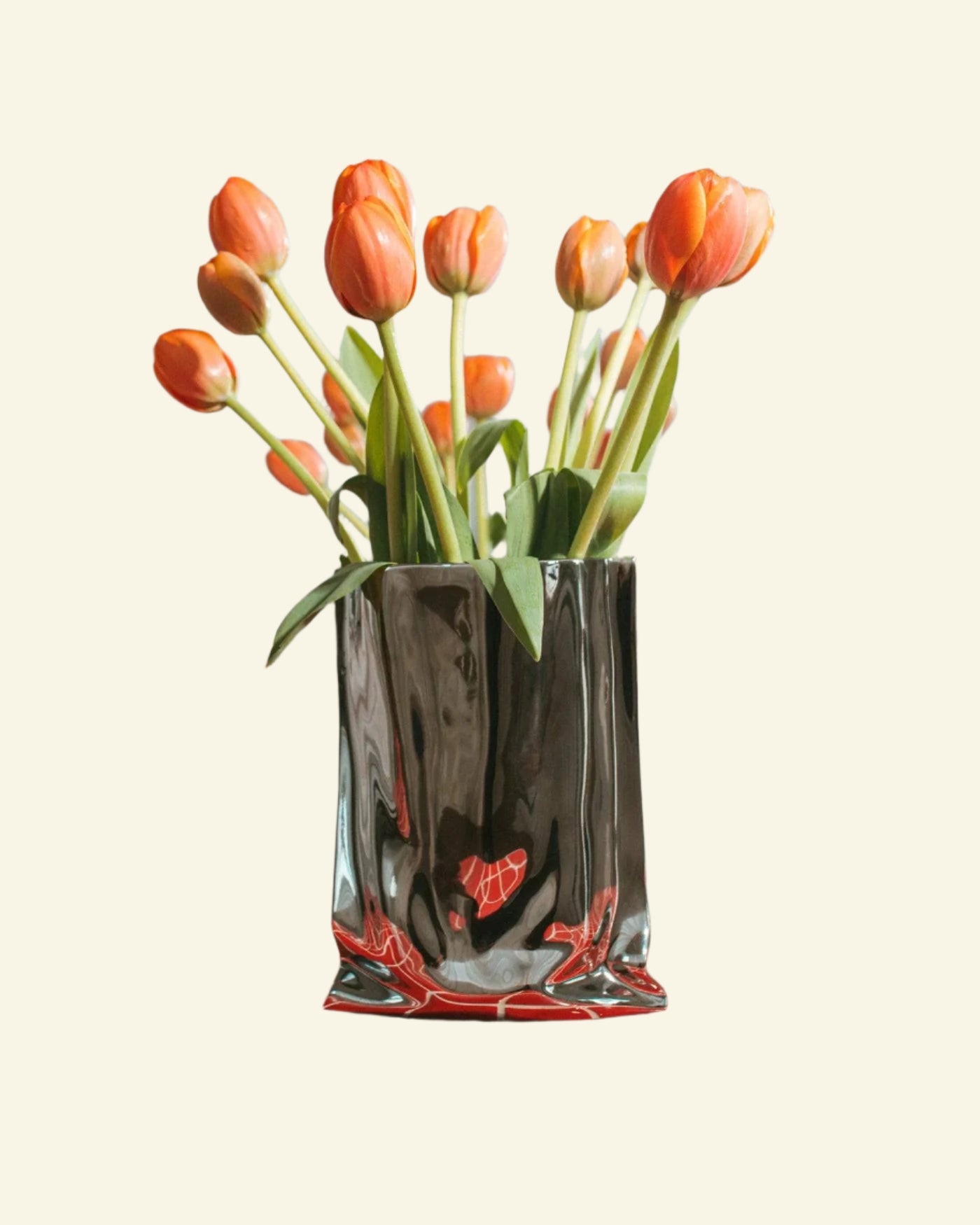 Chrome ceramic vase with a unique paper bag shape and shiny silver finish — a modern statement piece for stylish home decor.