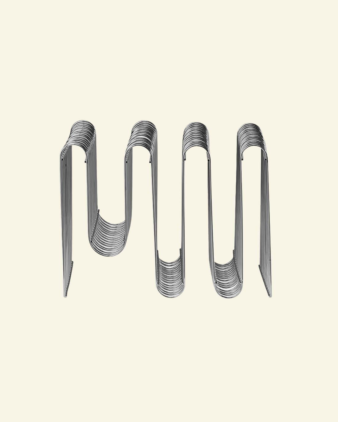 Chrome Curved Magazine Rack on beige background