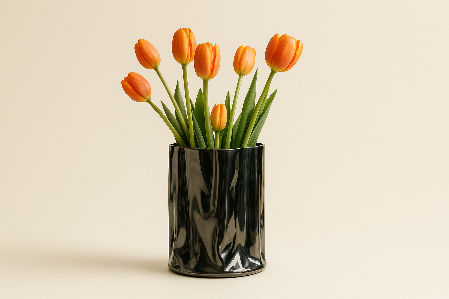 Chrome Flower Vase with orange tulips in it - beige background.