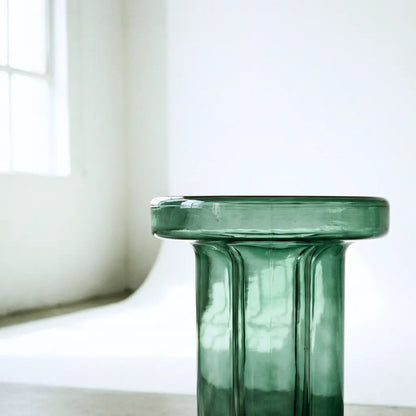 close up of the green glass end table in a photostudio