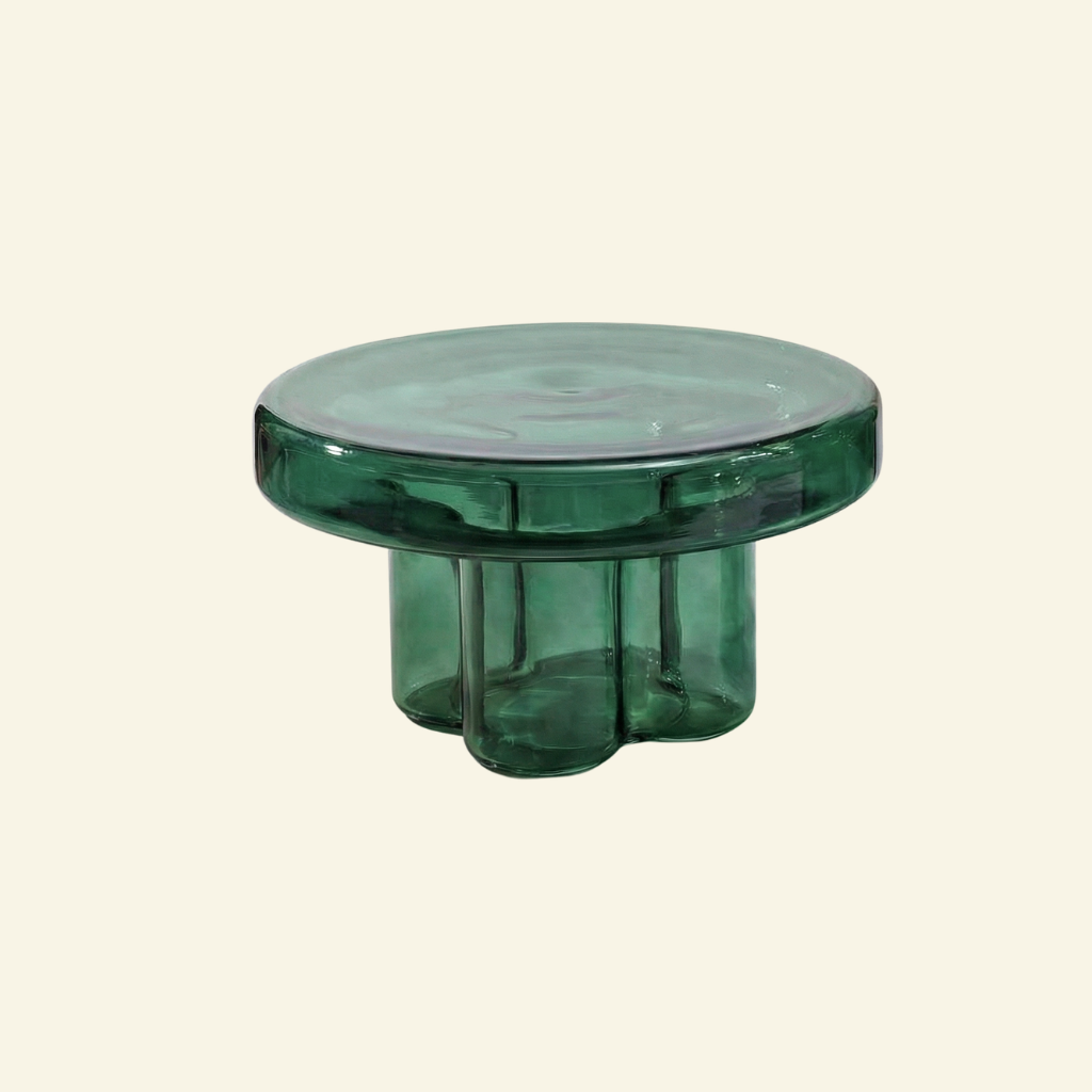 Wide Green glass side table on a beige background