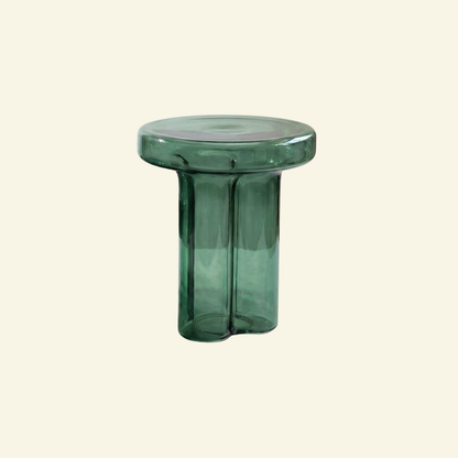 Tall Green glass side table on a beige background