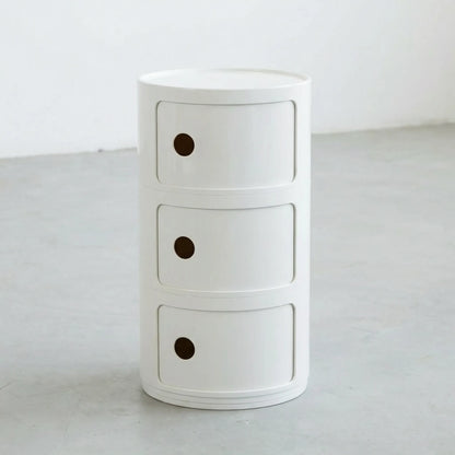 Kartell Componibili dupe round modular storage unit in white glossy plastic with three tiers on concrete floor in white studio