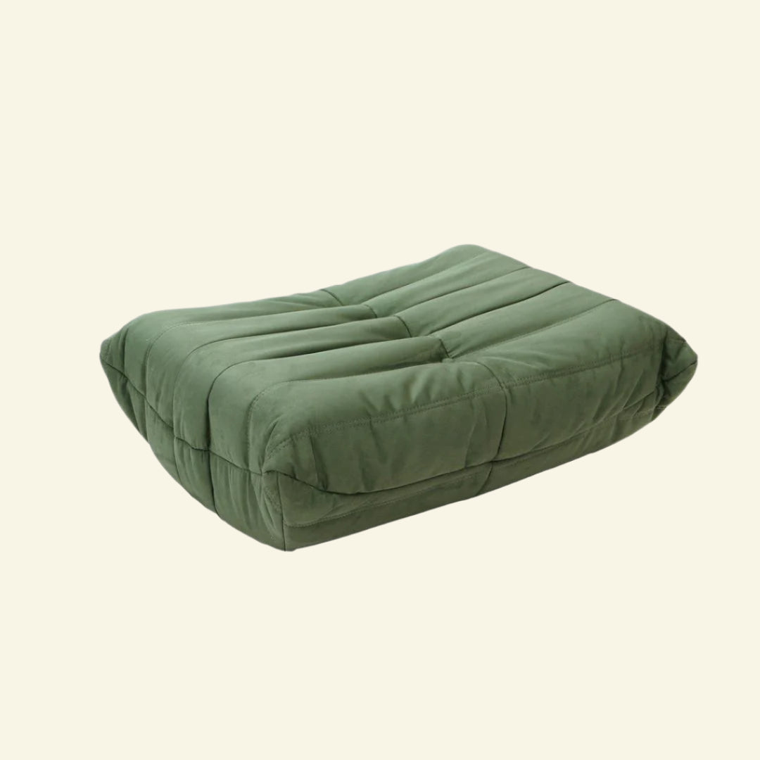 Matcha-green velvet Togo-style sofa , ottoman – low, frameless design with plush channel tufting