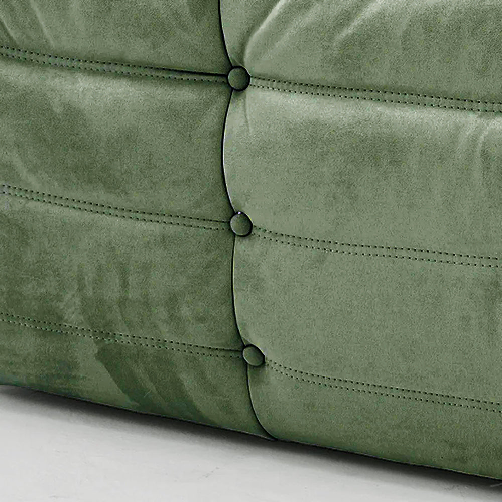 Close-up of matcha green velvet suede upholstery – soft, dirt-resistant fabric with luxurious texture