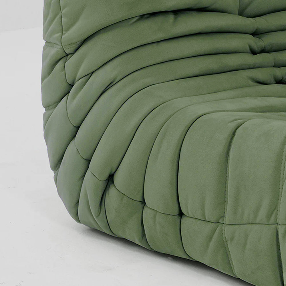 Close-up of matcha green velvet suede upholstery – soft, dirt-resistant fabric with luxurious texture