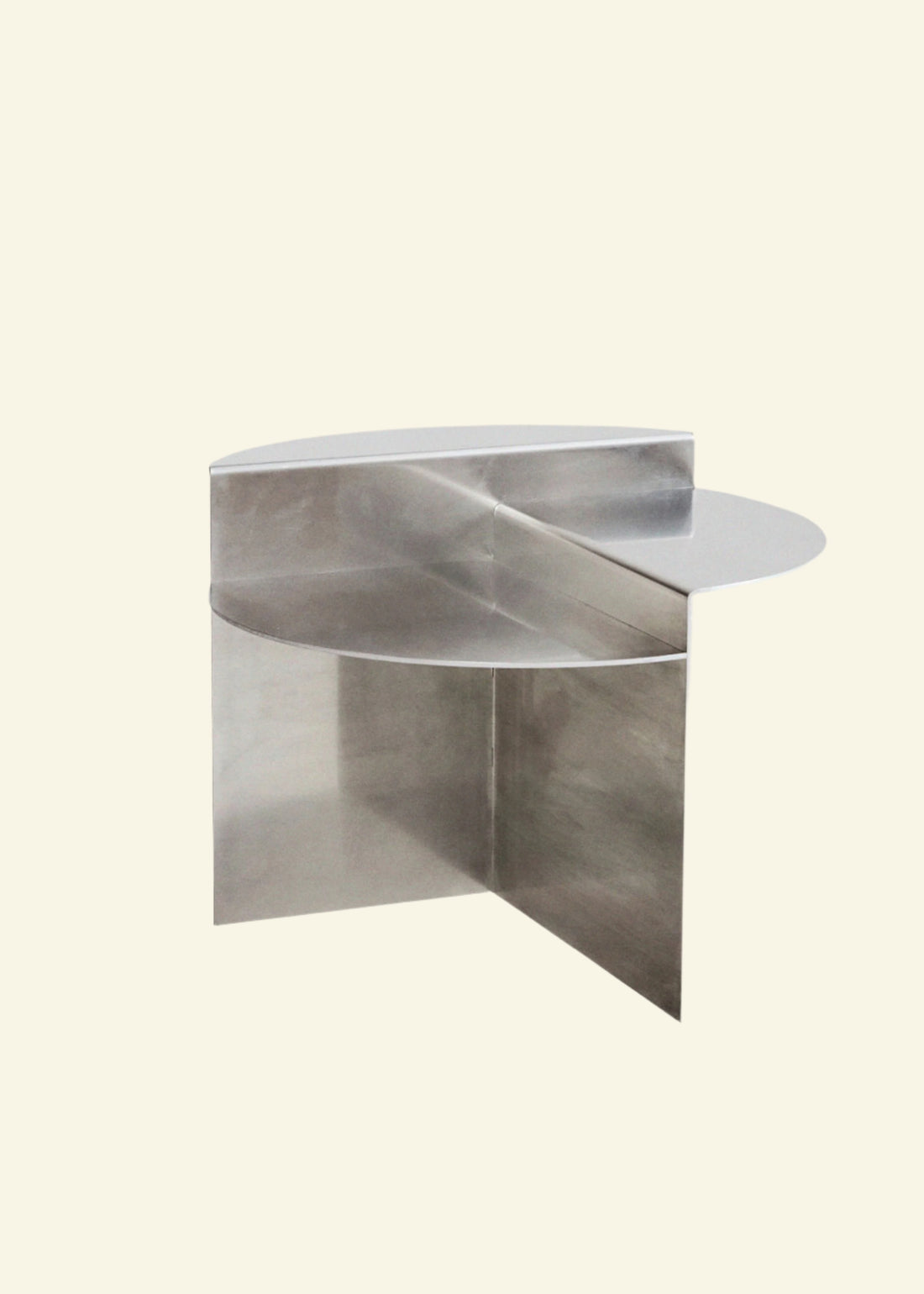 Modern geometric side table in polished chrome – sculptural stainless steel furniture for contemporary interiors