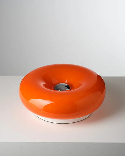Orange donut lamp on a white background