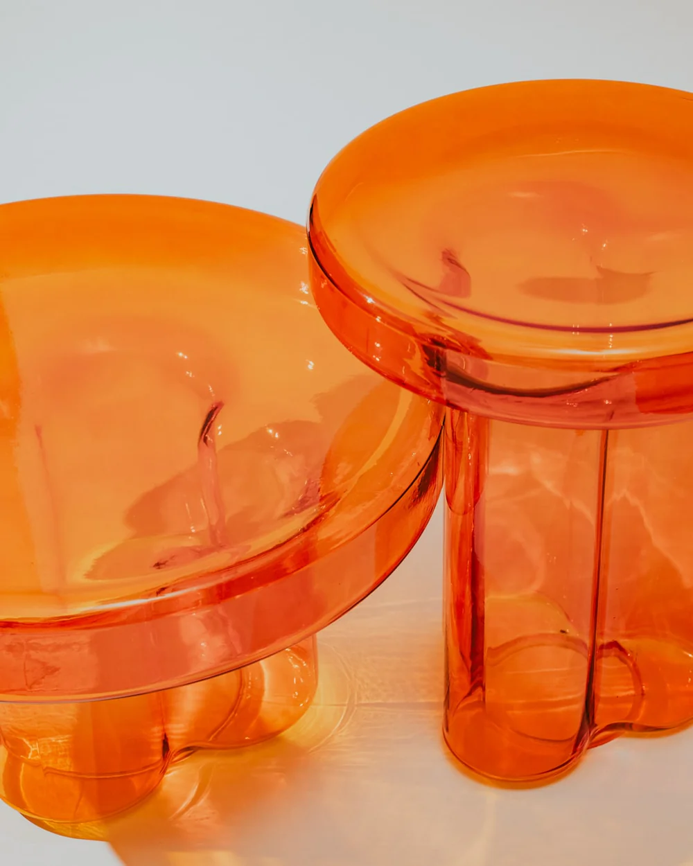 Orange glass side table in warm amber tones, versatile enough for use as a coffee table or side table