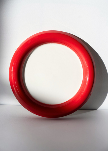 Two-Tone Chunky Ceramic Plate in red and white on a white background