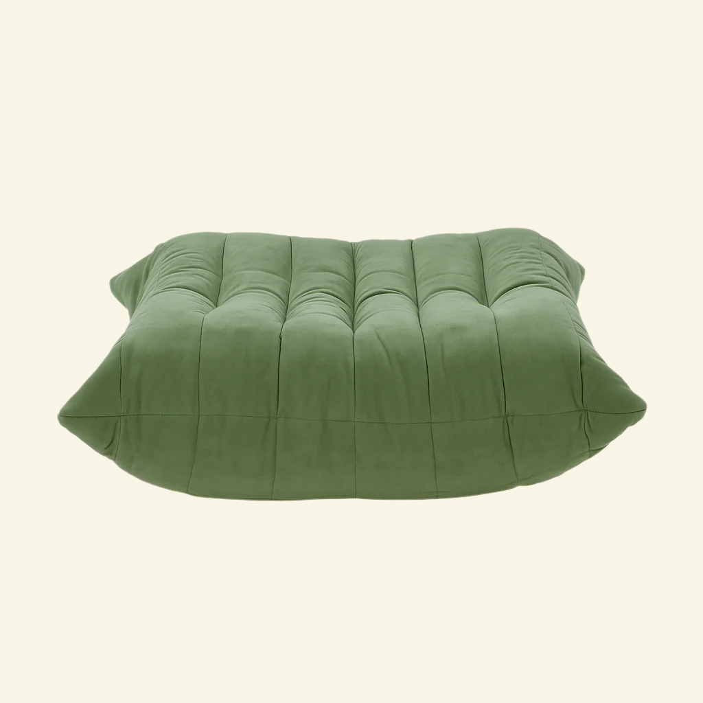 Matcha-green replica of the velvet Togo-style sofa chair , ottoman – low, frameless design with plush channel tufting