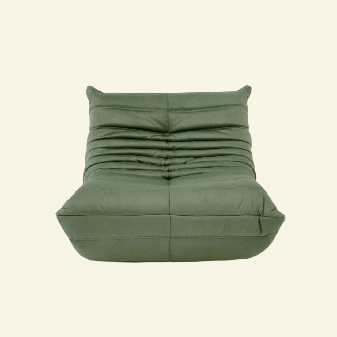 Replica of the green velvet Togo-chair by michael ducaroy– low, frameless design with plush channel tufting