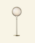 Modern retro golbe floor lamp with spherical glass shade on a beige background