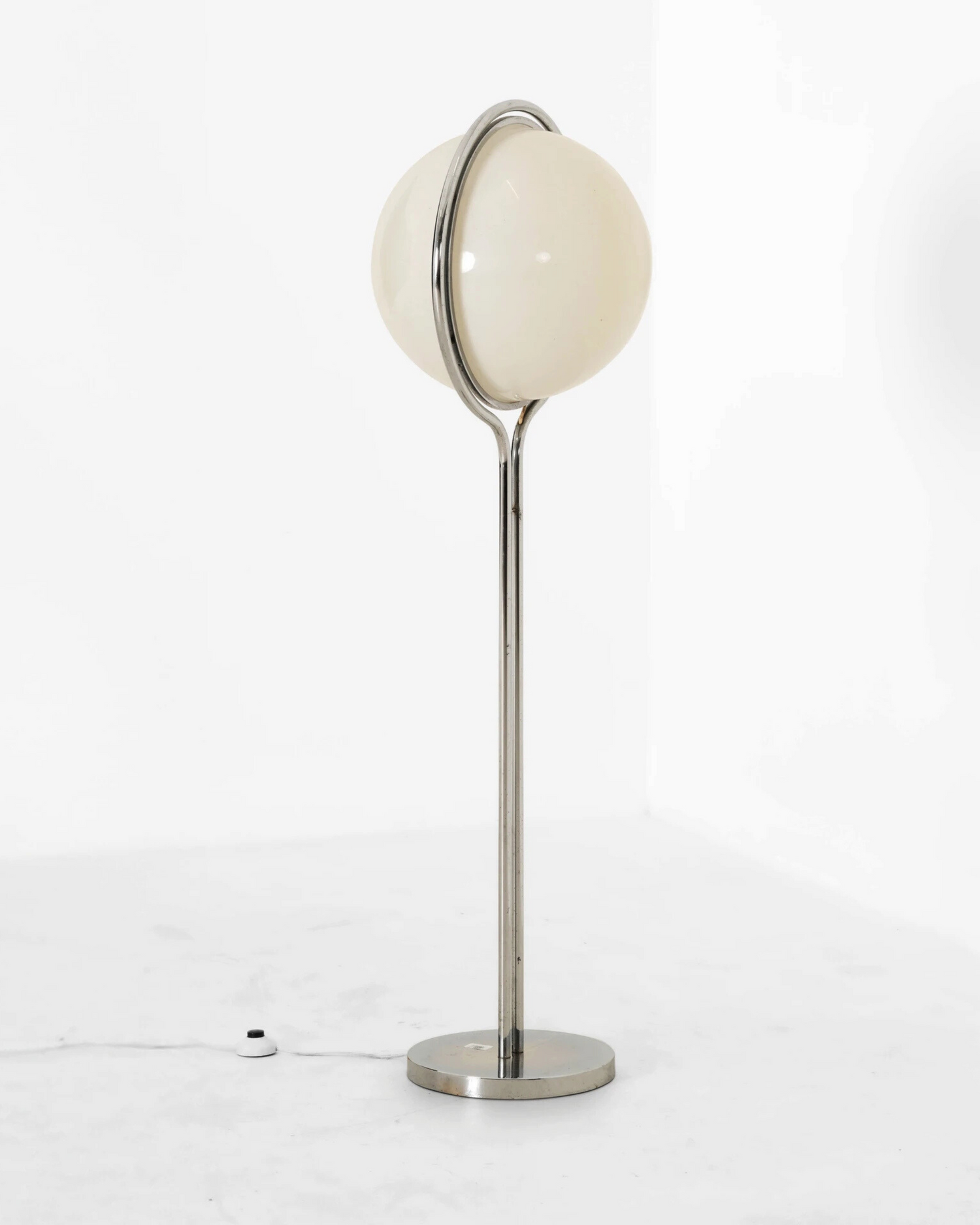 Modern retro globe floor lamp with two spherical white shades on a white background