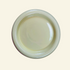 Round chunky thick ceramic plate on a beige background