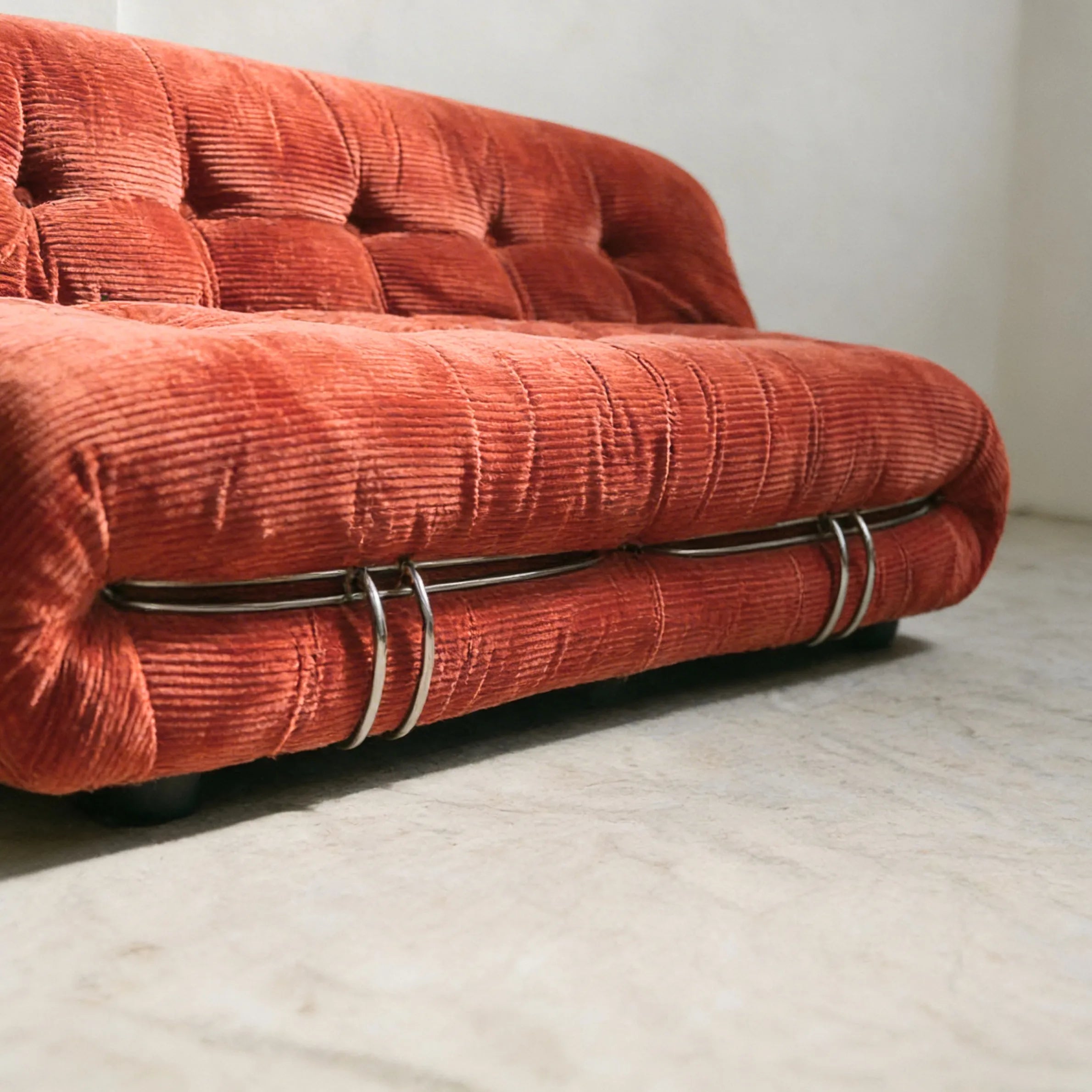 soriana sofa 2-seater dupe in terracotta corduroy close-up with chrome frame detail on light gray surface