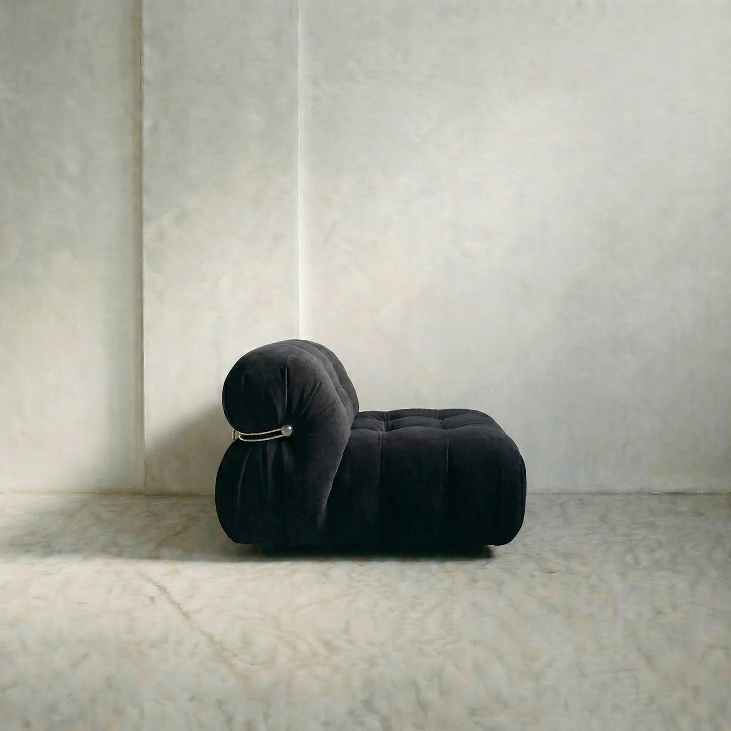 soriana sofa 2-seater dupe in black flannel close-up with chrome frame detail on light gray surface