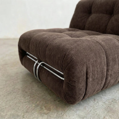 soriana chair dupe in chestnut corduroy close-up with chrome clamp detail on light background