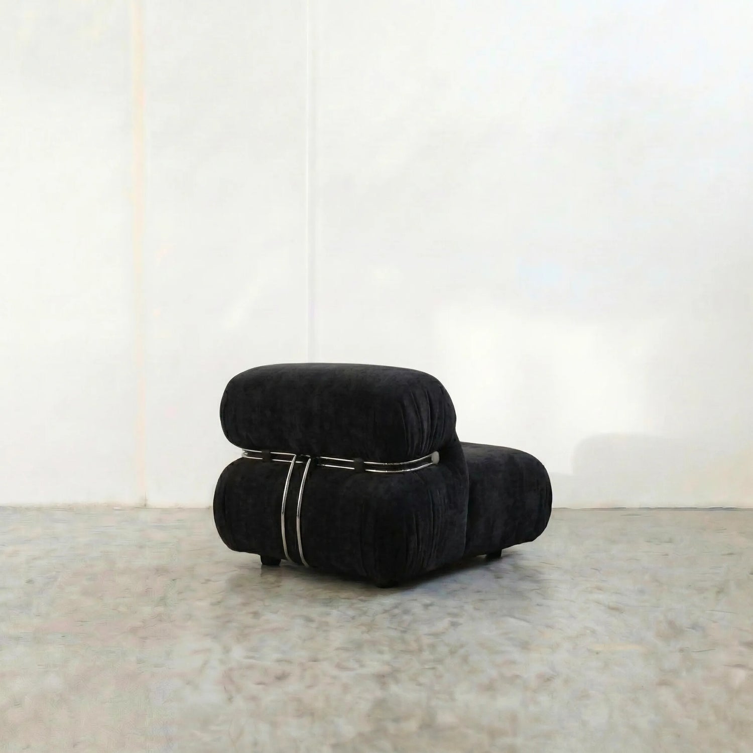 soriana chair dupe in black flannel close-up with chrome clamp detail on light background