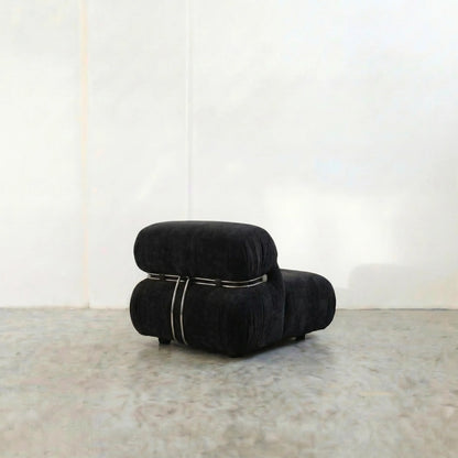 soriana chair dupe in black flannel close-up with chrome clamp detail on light background