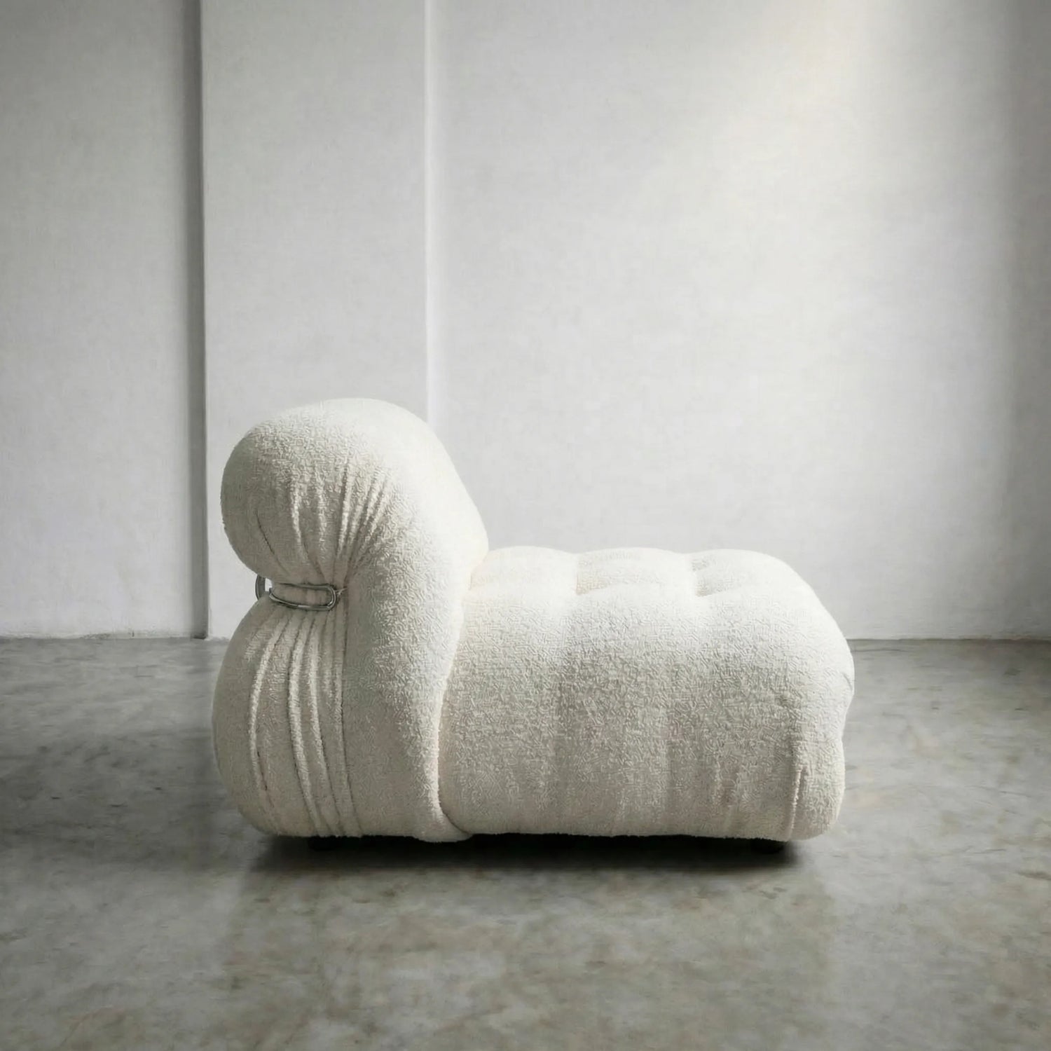 soriana chair dupe in white bouclé close-up with chrome frame detail on light gray surface