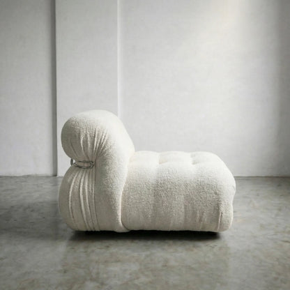 soriana chair dupe in white bouclé close-up with chrome frame detail on light gray surface