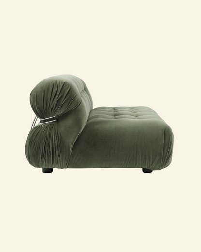 Green soriana velvet 2-seater sofa replica with unique design on a beige background
