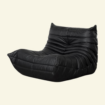 Black togo chair replica in leather on a beige background