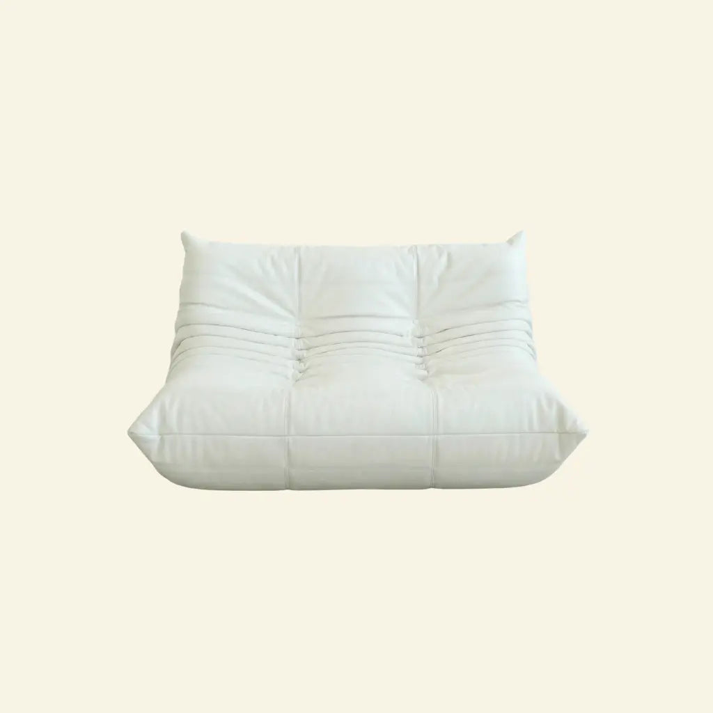 White togo sofa dupe in leather on a light beige background