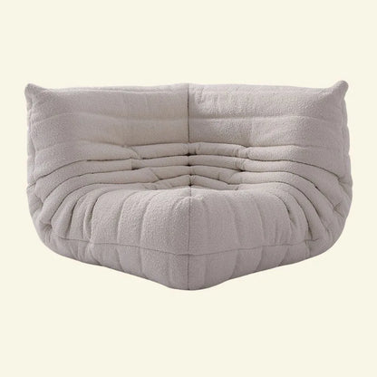 White Replica of the togo corner module in boucle on a beige background