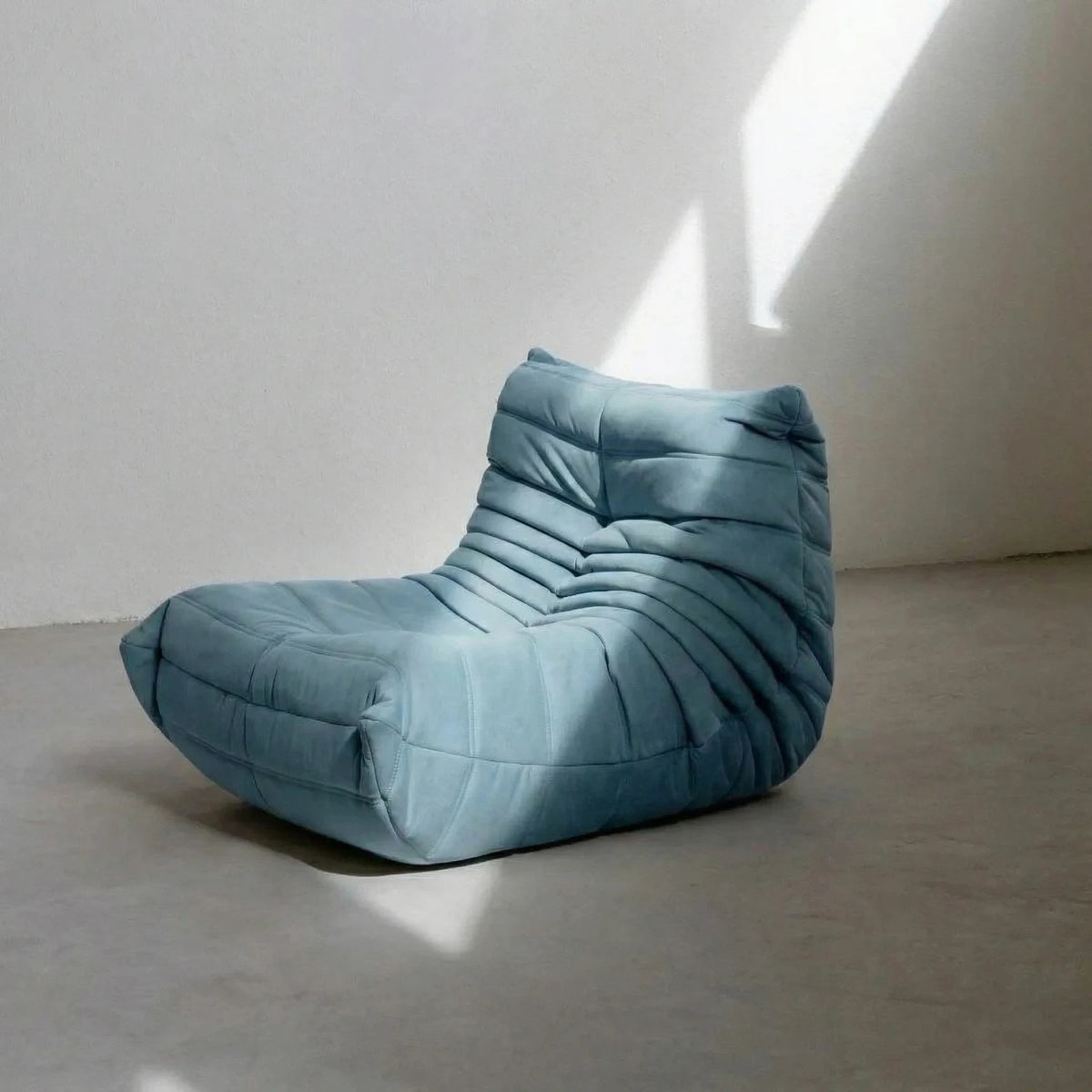 Handmade Bruma sofa chair in light blue velvet suede – plush high-density sponge filling for ergonomic comfort