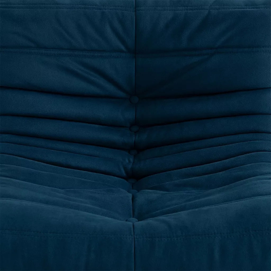 Close-up of the dark blue velvet suede upholstery Bruma fireside chair lounger – soft, dirt-resistant fabric with luxurious texture