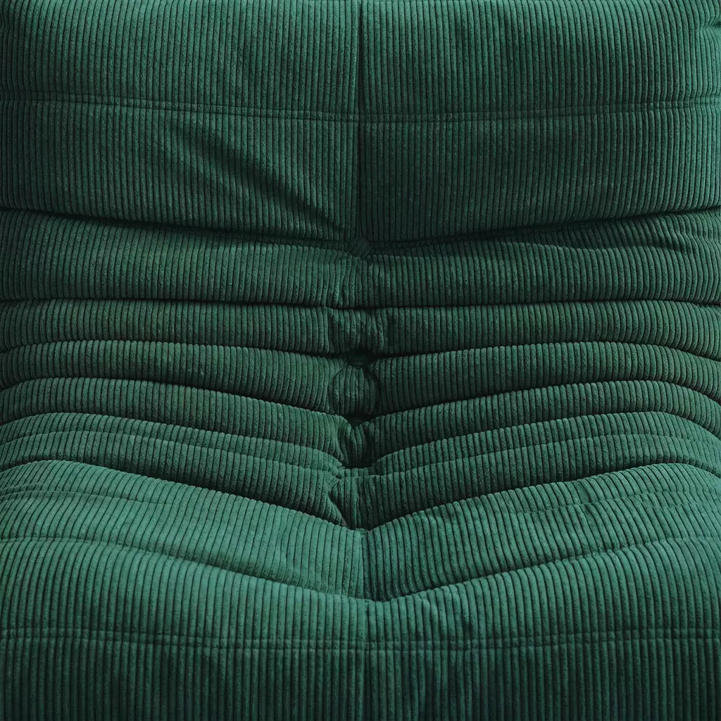 Close-up of the green corduroy Bruma fireside chair lounger – soft, dirt-resistant fabric with comfortable texture