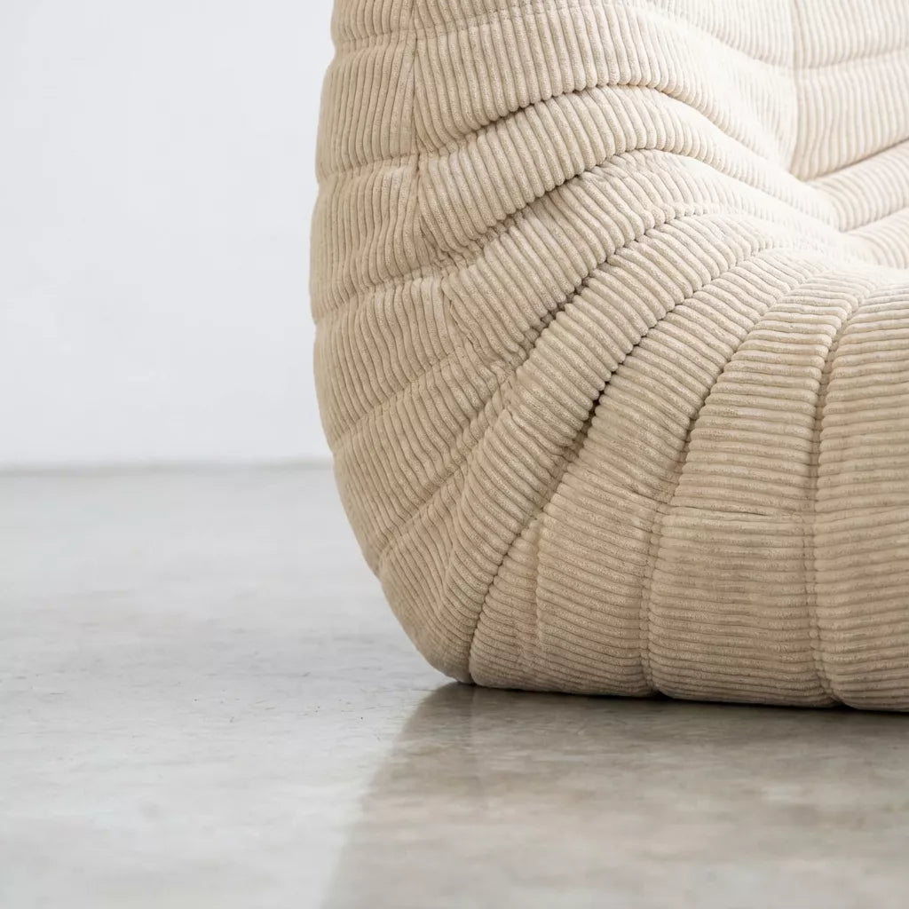 Close-up of the cream corduroy Bruma fireside chair lounger – soft, dirt-resistant fabric with comfortable texture