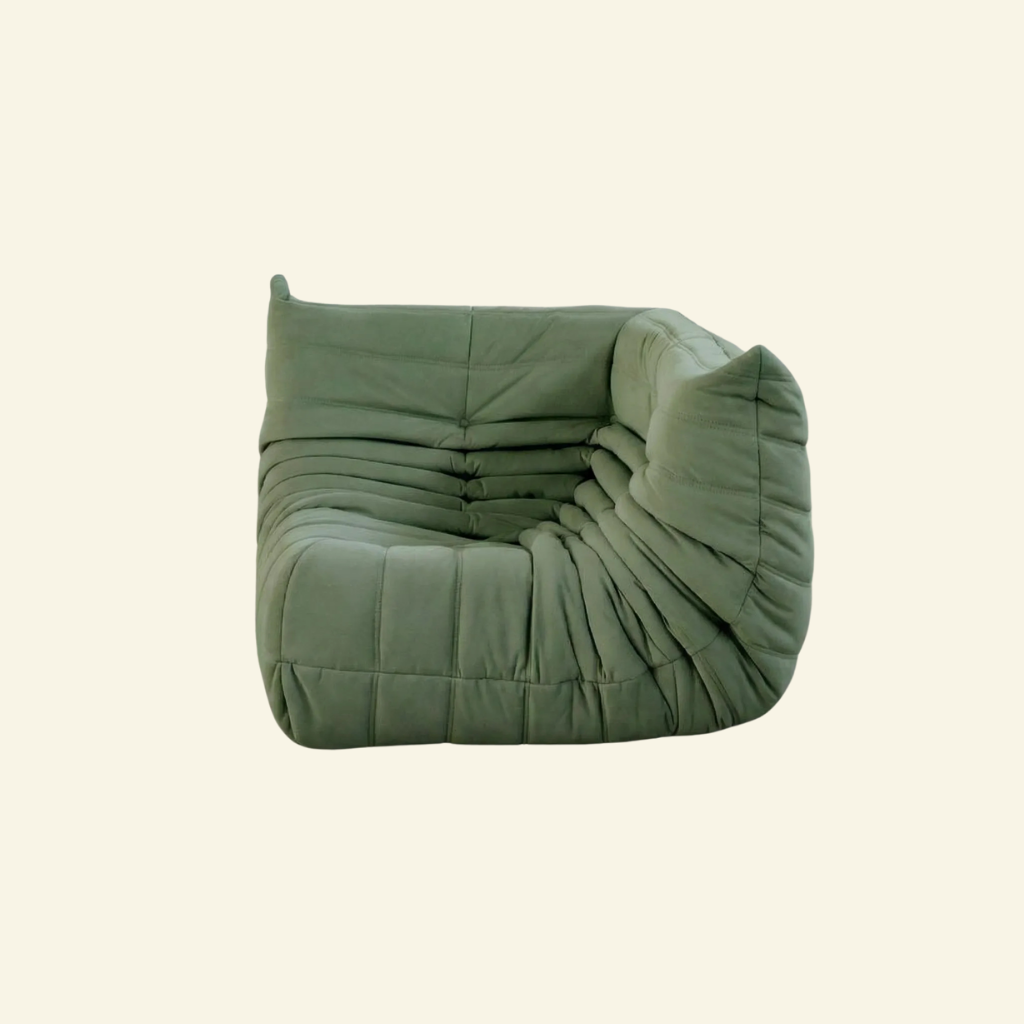 Bruma Sofa Corner in green velvet suede on a beige background