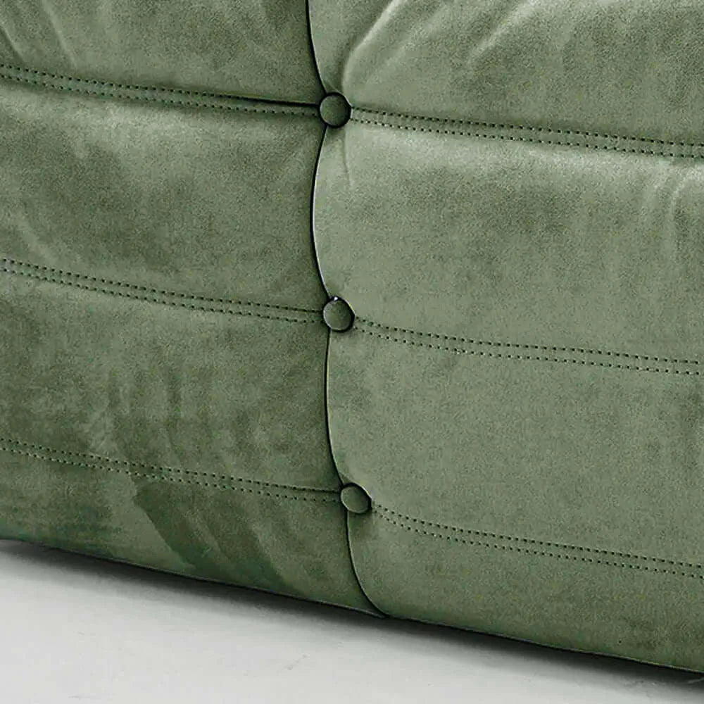 Close up of the fabric of the Bruma Sofa Corner in green velvet suede