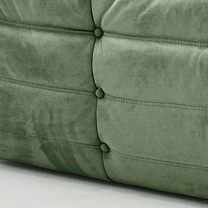 Close up of the fabric of the Bruma Sofa Corner in green velvet suede
